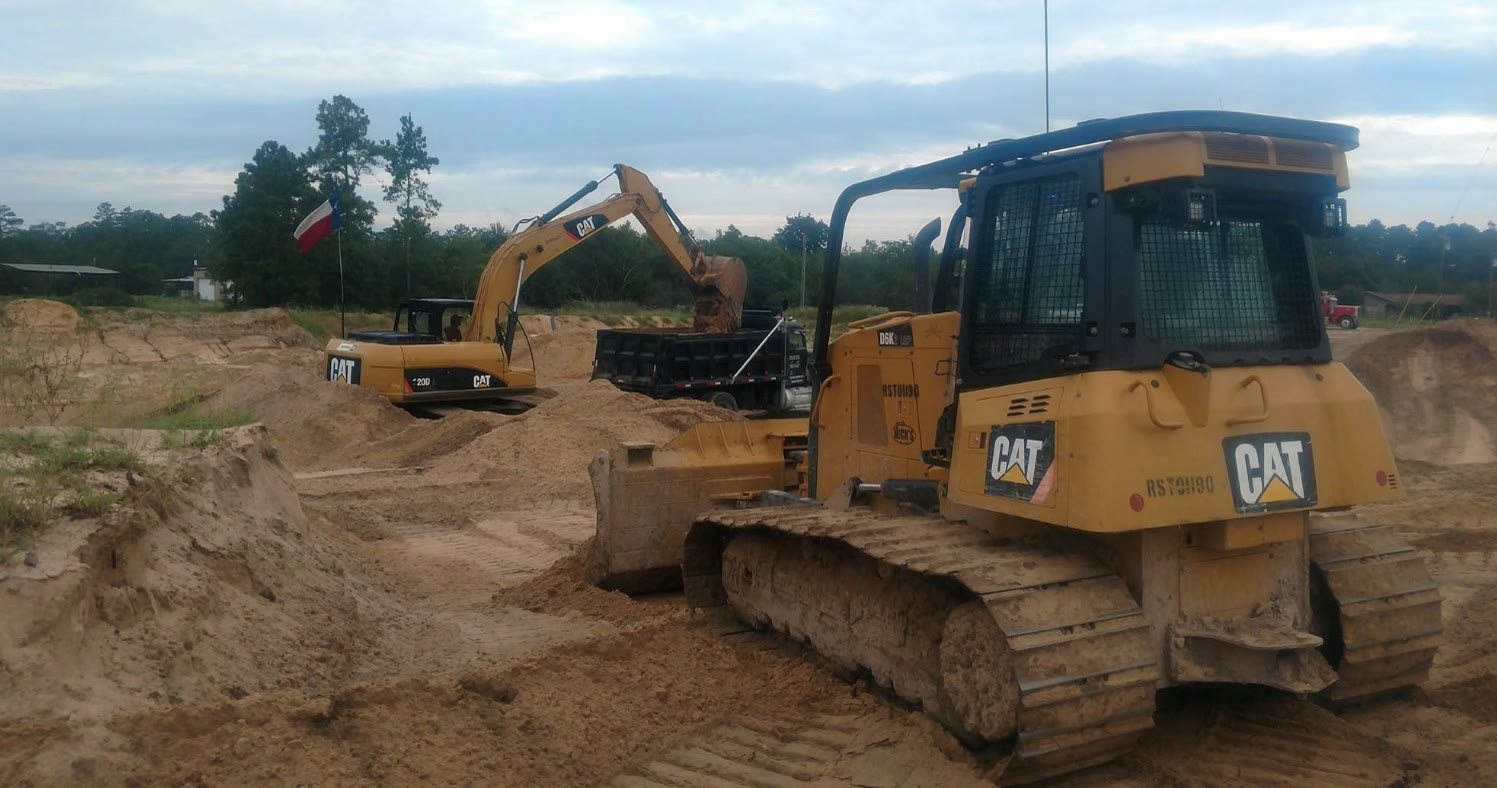 CAT dozer and excavator loading a truck at the sand pit